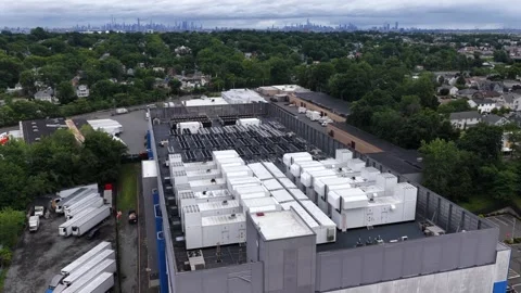 Rows of large white cooling generators fill data center rooftop in Clifton, New Stock Footage 340924861