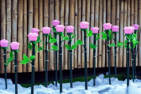 Rows of LED artificial pink rose lights in illuminated garden on artificial.. Stock Photos
