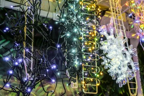 Rows of LED light garlands coiled on a steel frames Stock Photos