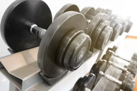 Rows of metal dumbbells Stock Photos
