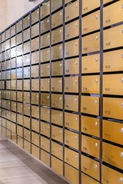 Rows of metallic mailbox in lobby of condominium building Foto stock