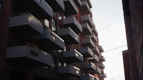 Rows Of Modern Balconies Cascade Down A Building In Warm Evening Light Stock Footage 340894630