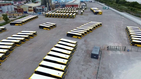 Rows of modern electric busses aerial view parked on industrial site 库存影片 342412457