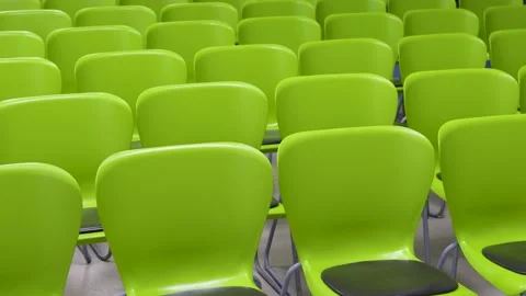 Rows of Modern Lime Green Plastic Chairs in Empty Hall. Rows of green plast.. Video stock 330637879