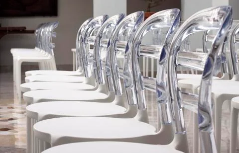 Rows modern plastic designed chairs Stock Photos