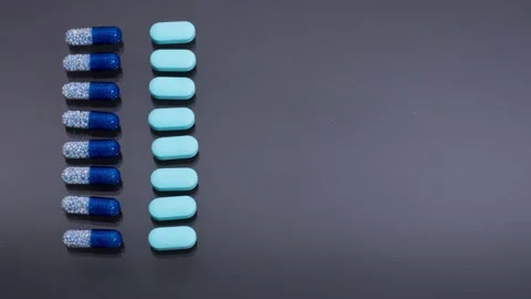 Rows of multi-colored capsules, pills and medicines 库存影片 173604328