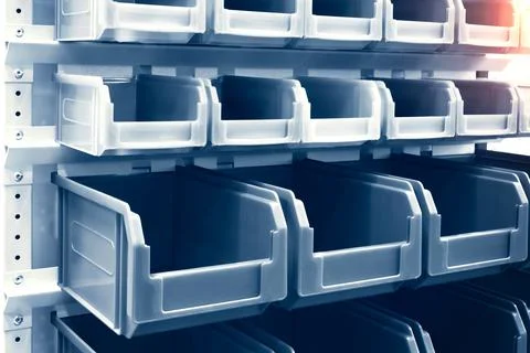 Rows of multicolored plastic boxes for components Foto stock