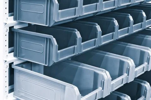 Rows of multicolored plastic boxes for components Stockfoto's