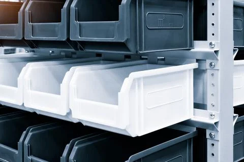 Rows of multicolored plastic boxes for components Foto stock