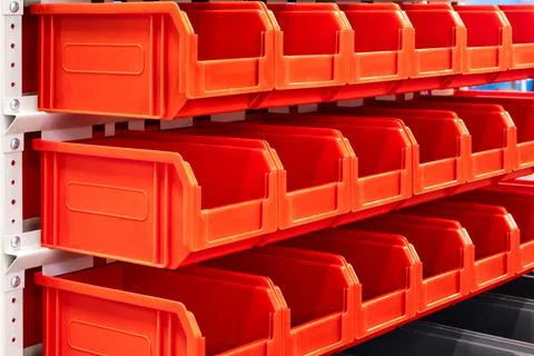 Rows of multicolored plastic boxes for components Foto stock