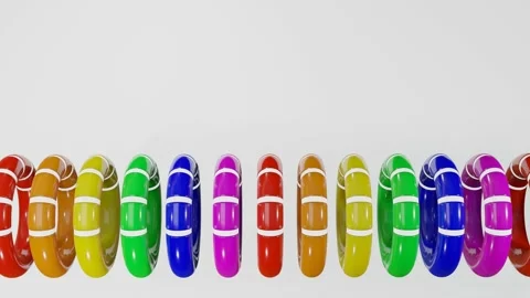 Rows of multicolored smooth rainbow rings with white cutouts rotate slowly again Stock Footage 163093254