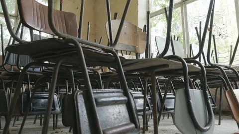 Rows of old chairs in an abandoned restaurant, public dining room. Stock Footage 81803459
