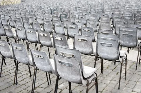Rows of old empty chairs on square, Vienna Foto stock