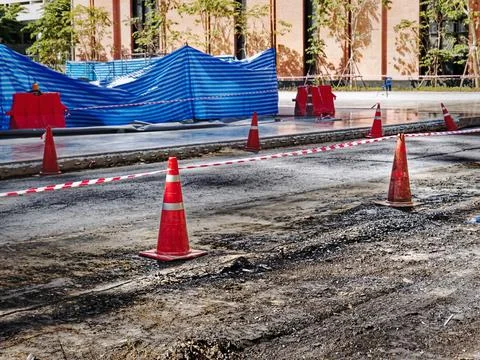 Rows of Orange Road Cones Along the Road of Construction Site Stock Photos