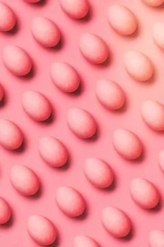 Rows of painted pink eggs 库存照片