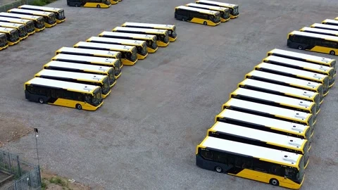 Rows of parked electric busses aerial view establishing industrial site 库存影片 342402987