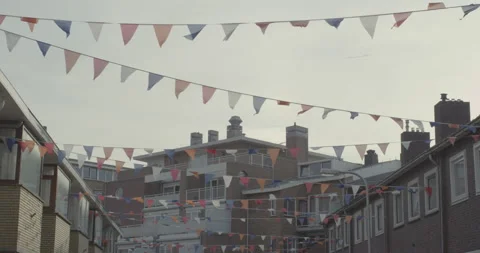 Rows with party flags fluttering in the wind in a city street Stock Footage 145149207