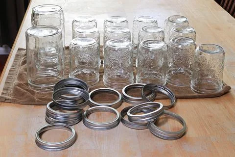 Rows of pickling jars drying upsidedown on a table Stock Photos