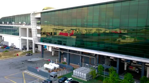 Rows Of Planes Reflected In Glass Facade Of Airport Terminal Video stock 53889051