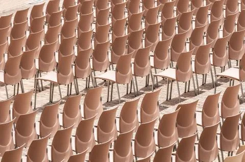 Rows of plastic chairs. Stock Photos