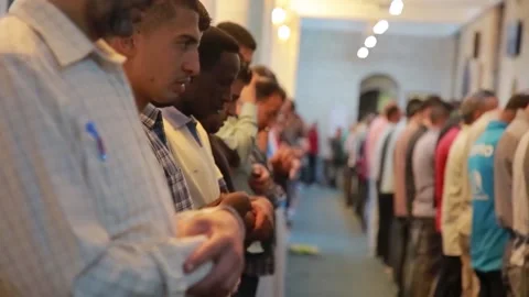 Rows of prayers doing Tarawih prayers at Al-Husseini Mosque Stock Footage 236586498