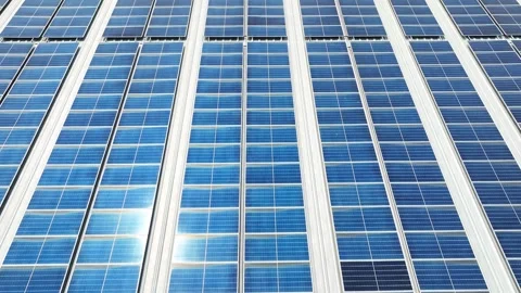 Rows of pristine blue solar panels on the rooftop, aerial view. Stock Footage 272285783