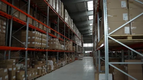 Rows of racks with cardboard boxes in warehouse Video stock 161948288