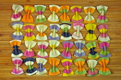 Rows of rainbow pasta bows Stock Photos