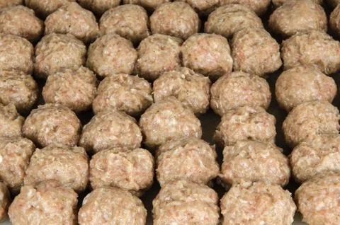 Rows of raw meatballs Stock Photos