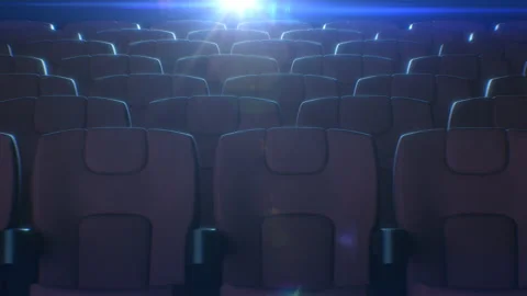 Rows of Red Chairs in Cinema Hall with Flashing Movie Projector Light at the Stock Footage 112338367