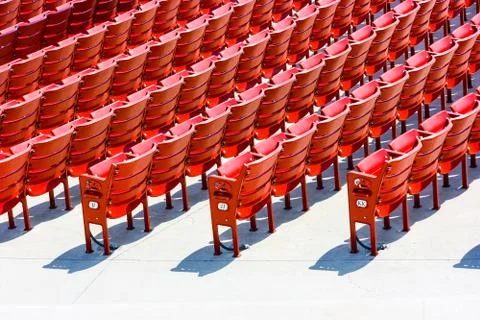 Rows of red plastic seats Stock Photos