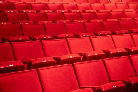 Rows of Red Theater Seats in Empty Auditorium Stock Photos