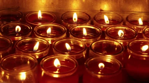 Rows of Red Votive Candles Burning in Glass Cups at Temple Altar Stock-Footage 342528293