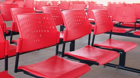 Rows of red waiting chairs with no people. Concept of queue, public service Stock Footage 329819852