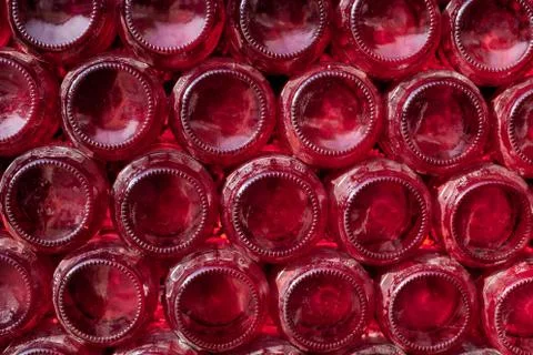 Rows of red wine bottles, concept of winery. 스톡 사진