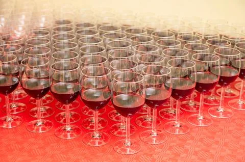 Rows of Red Wine Glasses on Event Catering Table Stock Photos