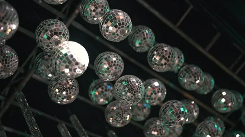 Rows of Reflective Disco Balls Hanging from Ceiling in Dimly Lit Venue Stock Footage 334169404