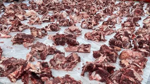 Rows of sacrificial meat cuts prepared by the Indonesian Muslim community Stock Photos