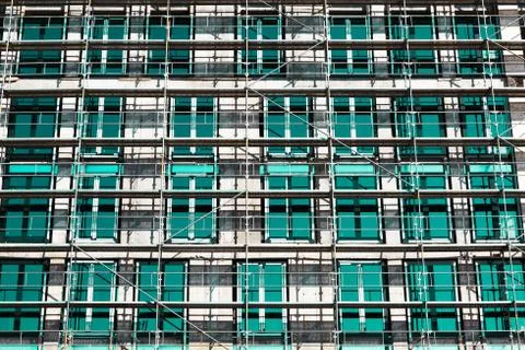 Rows of scaffolding over windows Stock Photos