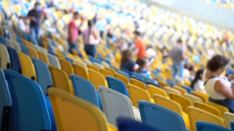 Rows of seats in the stadium. Viewers are going to watch the event Stock Footage 78532787