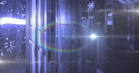 Rows of server racks glowing with blue lights in data center Foto stock
