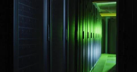 Rows of servers in data center glowing with green ambient light 库存插图