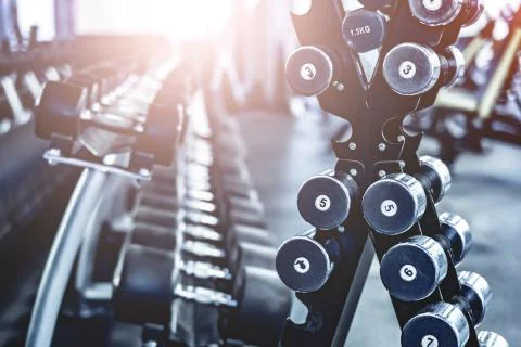 Rows with a set of dumbbells Stock Photos
