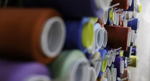Rows of sewing threads of various colors Stock Photos