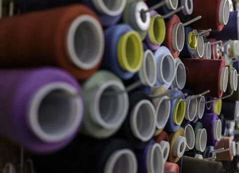 Rows of sewing threads of various colors Stock Photos