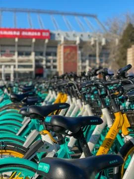 Rows of sharing bikes on the road in Beijing. China Stock Photos
