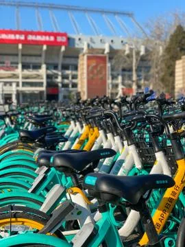 Rows of sharing bikes on the road in Beijing. China Stock Photos