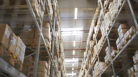Rows of shelves with boxes in factory warehouse. RAW video record Stock Footage 61305886