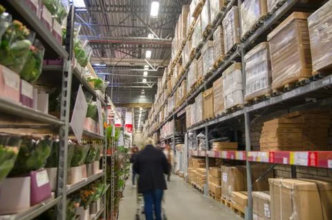 Rows of shelves with boxes in modern warehouse Stock Photos