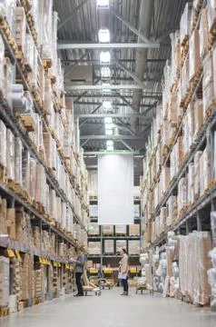 Rows of shelves with boxes in modern warehouse Stock-Fotos